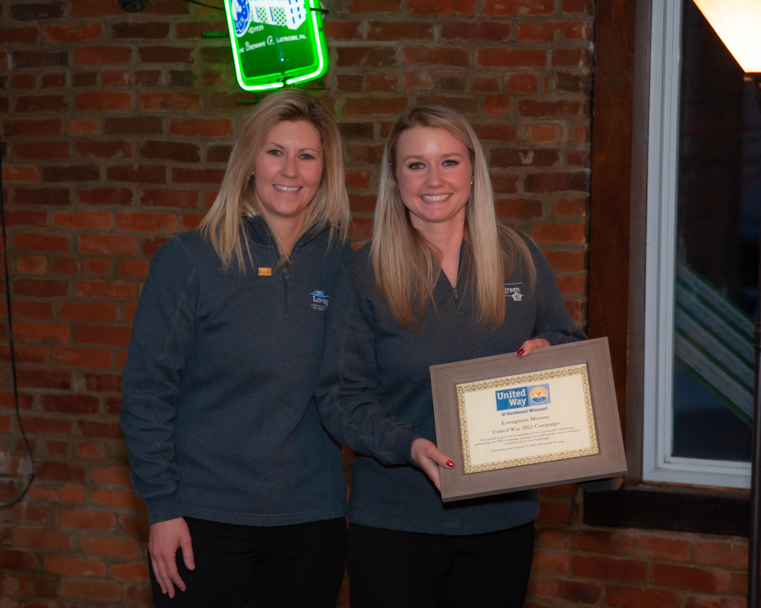 Courtney and Katie Lovegreen accepting Lovegreen Motors Retail Employee Giving Award.